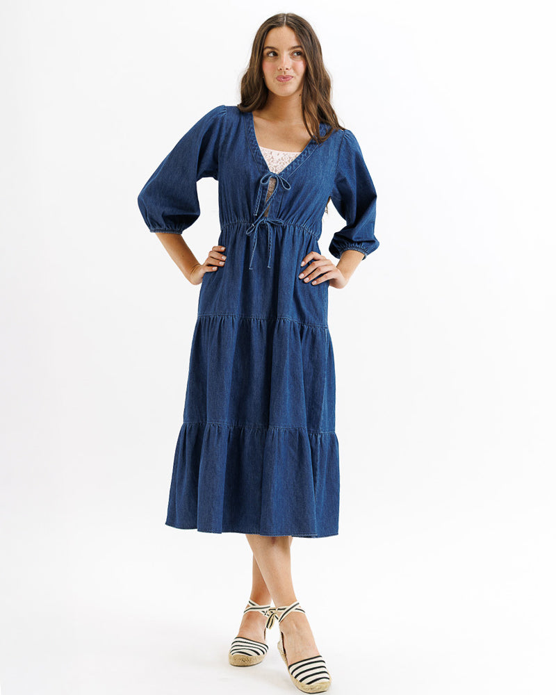 Woman wearing a blue dress on a white background