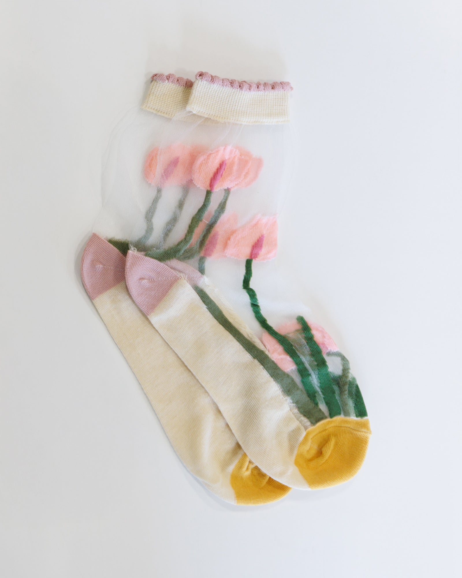 Pair of socks with floral design on a white background