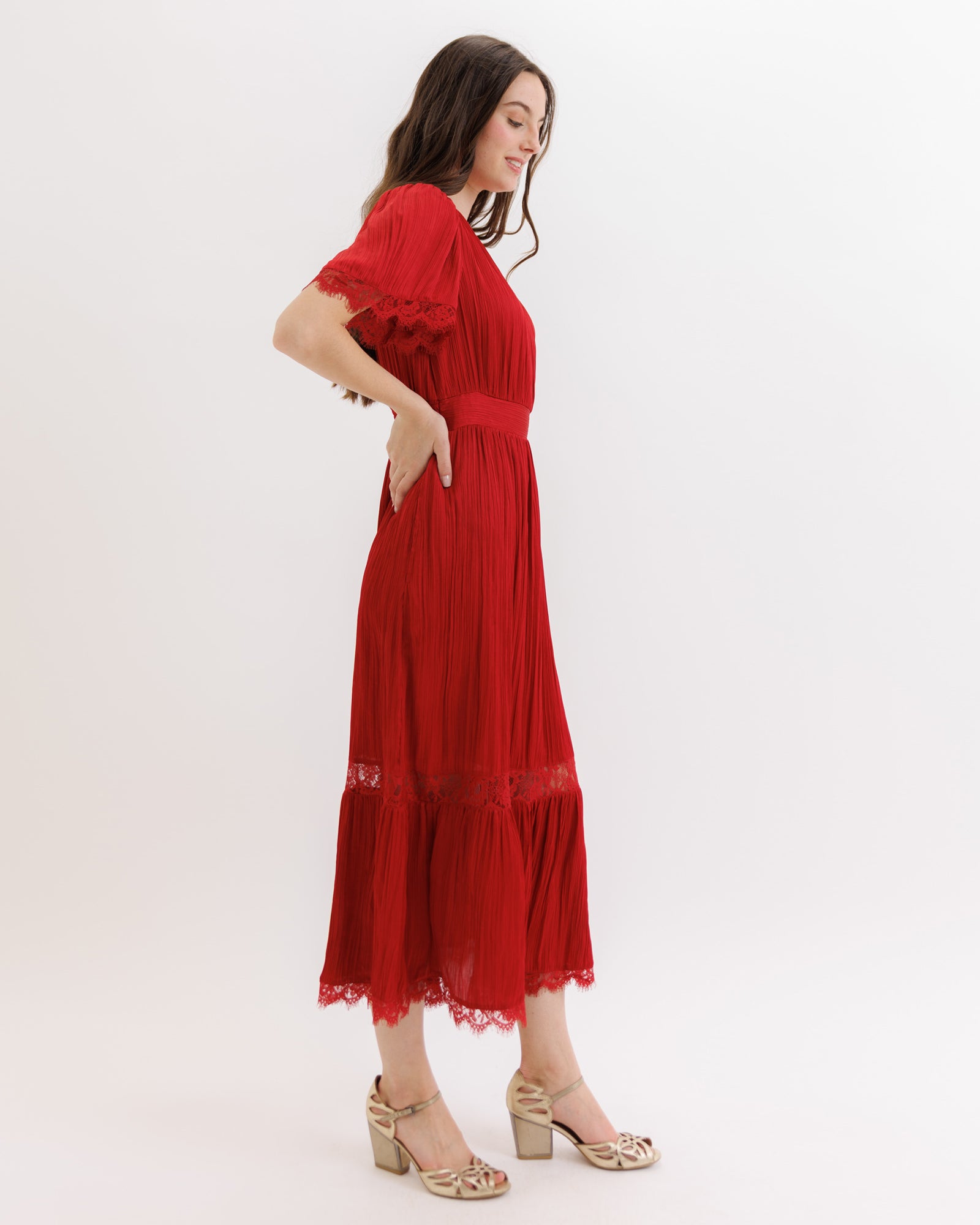 Woman wearing a red dress on a white background