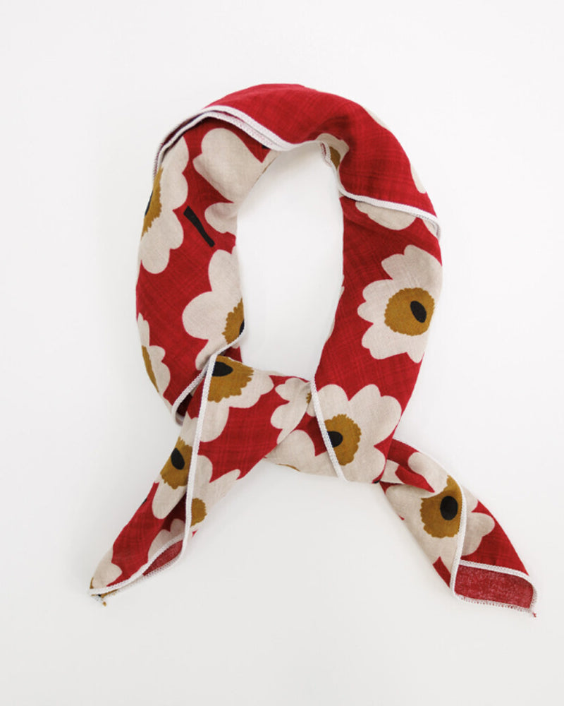 Red floral patterned scarf on a white background