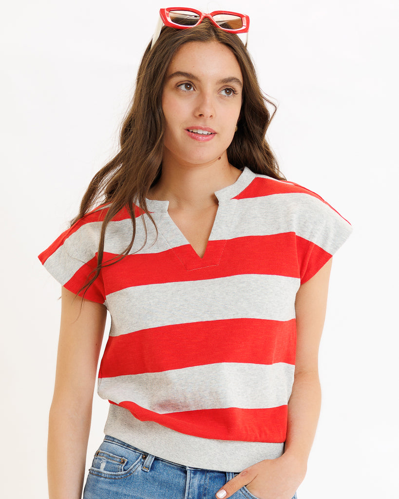 Model wearing a gray and red striped short sleeve v-neck banded tee