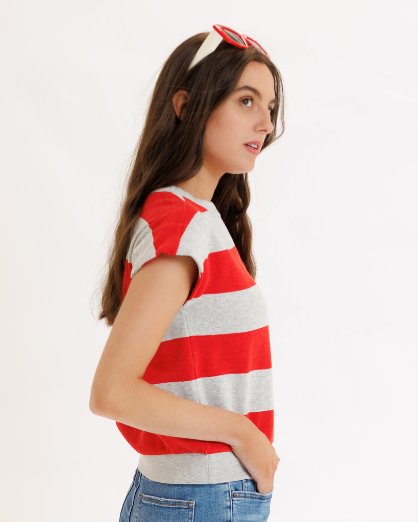 Model wearing a gray and red striped short sleeve v-neck banded tee