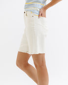 White denim shorts worn by a person on a white background