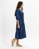 Woman wearing a blue dress on a white background