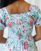 Floral dress with a square neckline on a white background