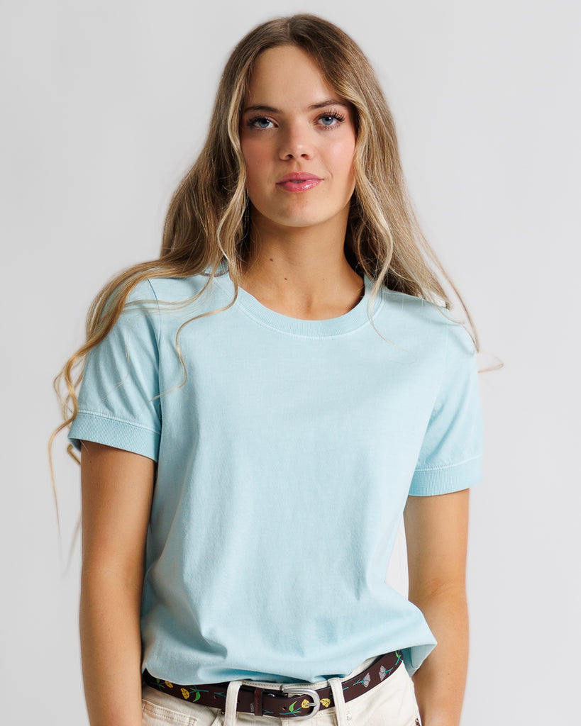 Model wearing a light blue short sleeve basic tee.