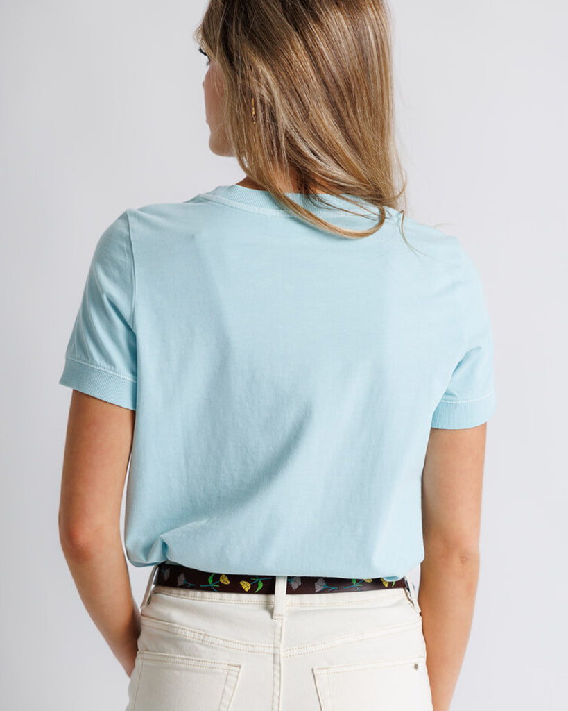 Model wearing a light blue short sleeve basic tee.