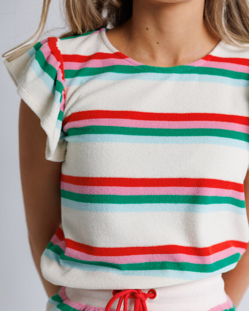 Model wearing a white, pink, green and blue striped short flutter sleeve terry top