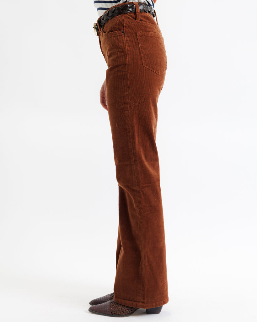 Brown corduroy pants on a white background