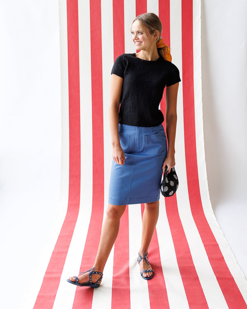 Model wearing a blue knee length pencil skirt