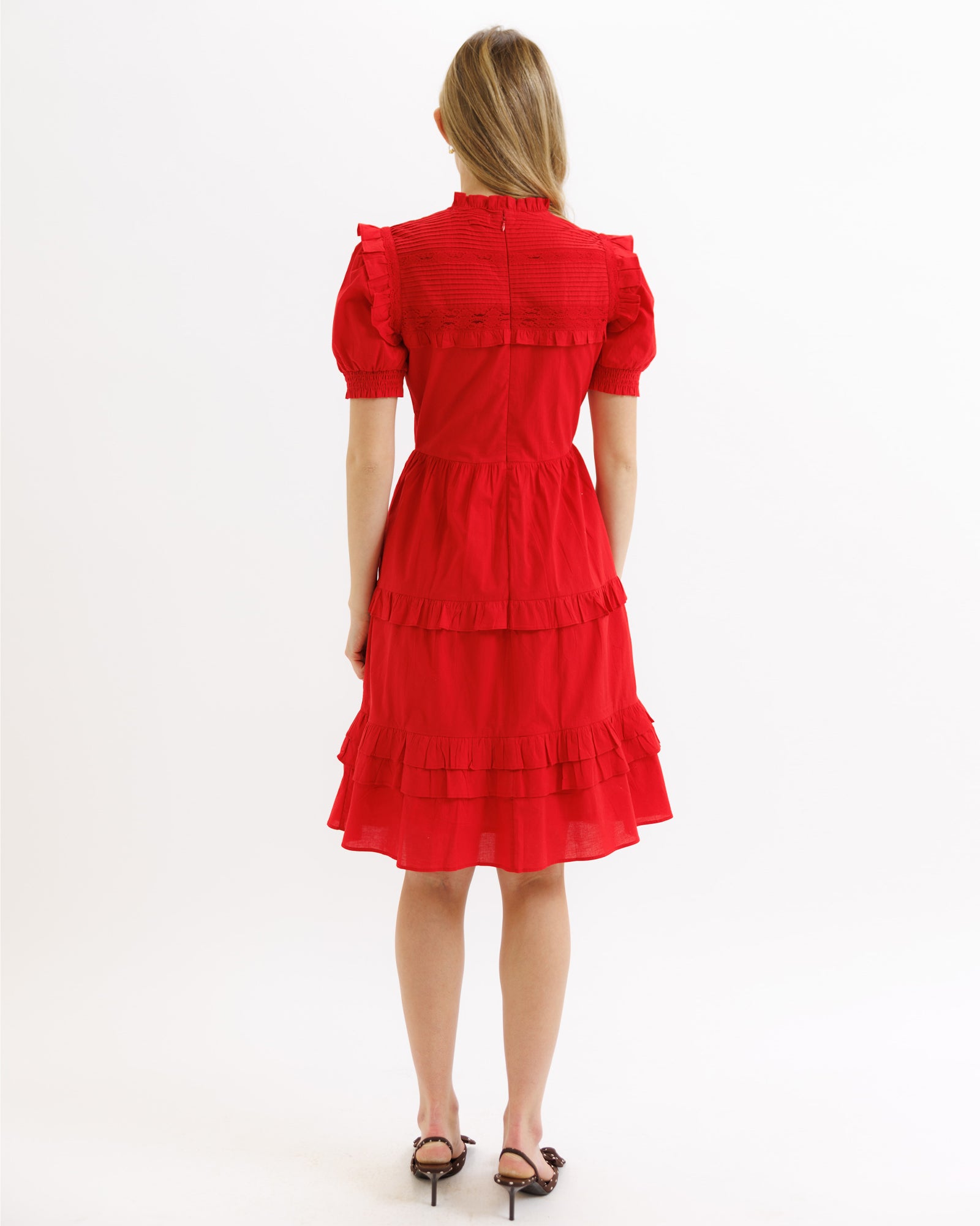 Red dress with puff sleeves on a white background