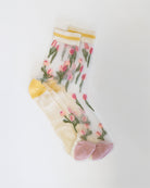 Sheer socks with floral design on a white background