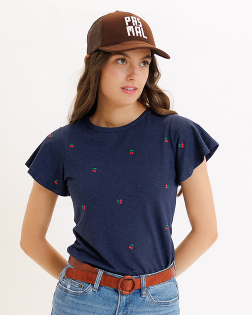 Model wearing a navy with embroidered cherry short sleeve round neck t-shirt