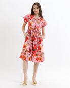 Woman wearing a floral dress on a white background