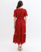 Red dress with lace details on a white background