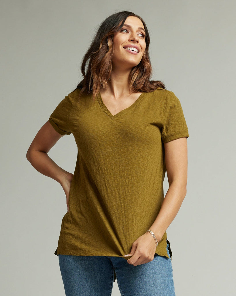 Woman in a short sleeve, v-neck, green blouse