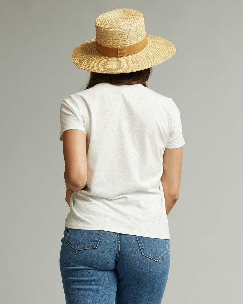 Woman in a short sleeve white graphic tee with a banana on the front