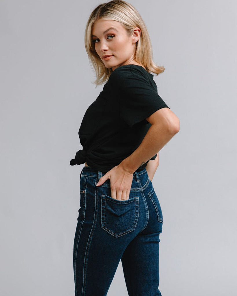 Woman in mid-rise blue jeans