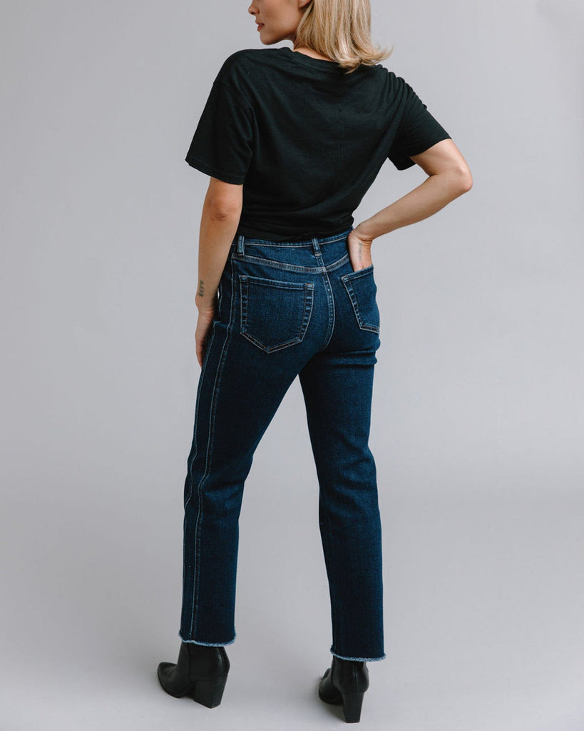 Woman in mid-rise blue jeans