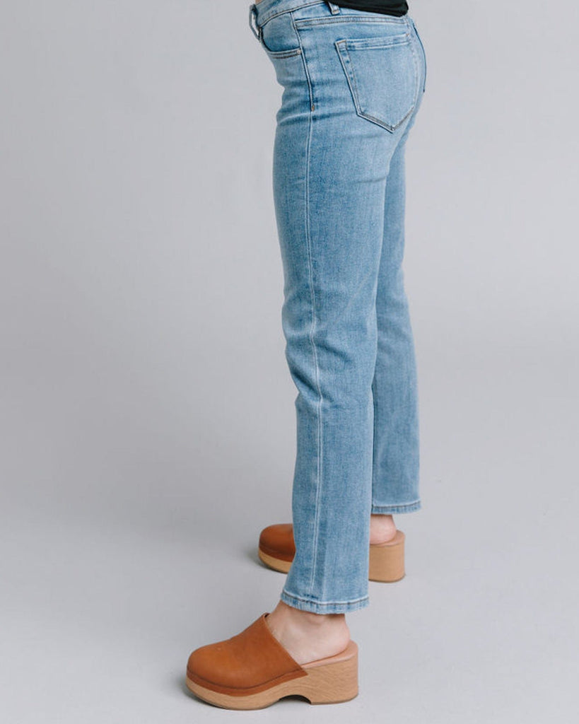 Woman in blue mid-rise straight jeans