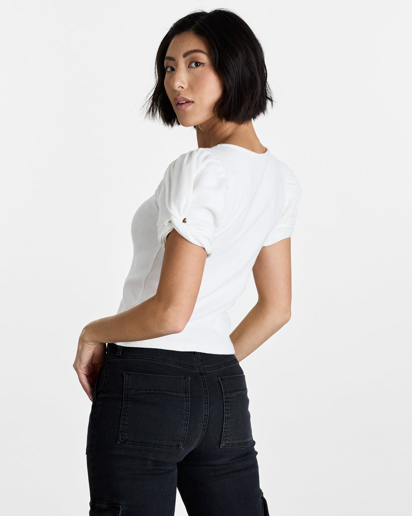 Woman in a white short sleeve t-shirt