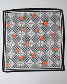 Checkered scarf with floral patterns on a gray background