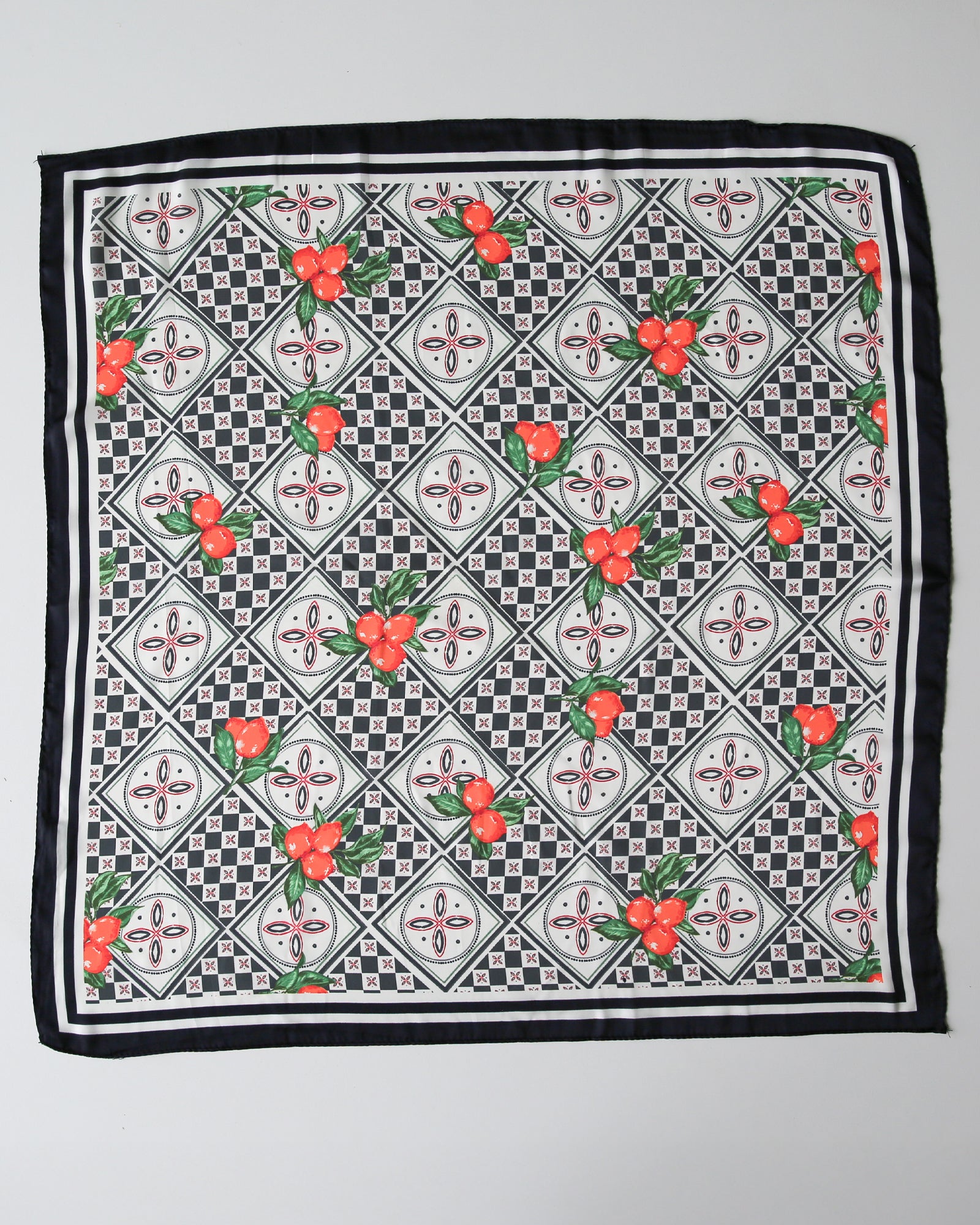 Checkered scarf with floral patterns on a gray background
