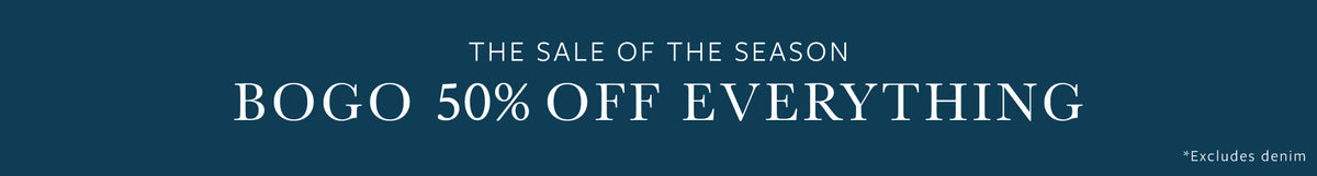 A dark teal promotional banner with white text reading 'THE SALE OF THE SEASON BOGO 50% OFF EVERYTHING' and a small '*Excludes design' note at the lower right.