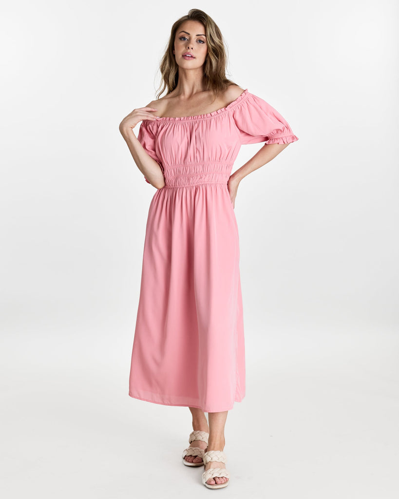 Woman in a short sleeve, off the shoulder, midi-length dress