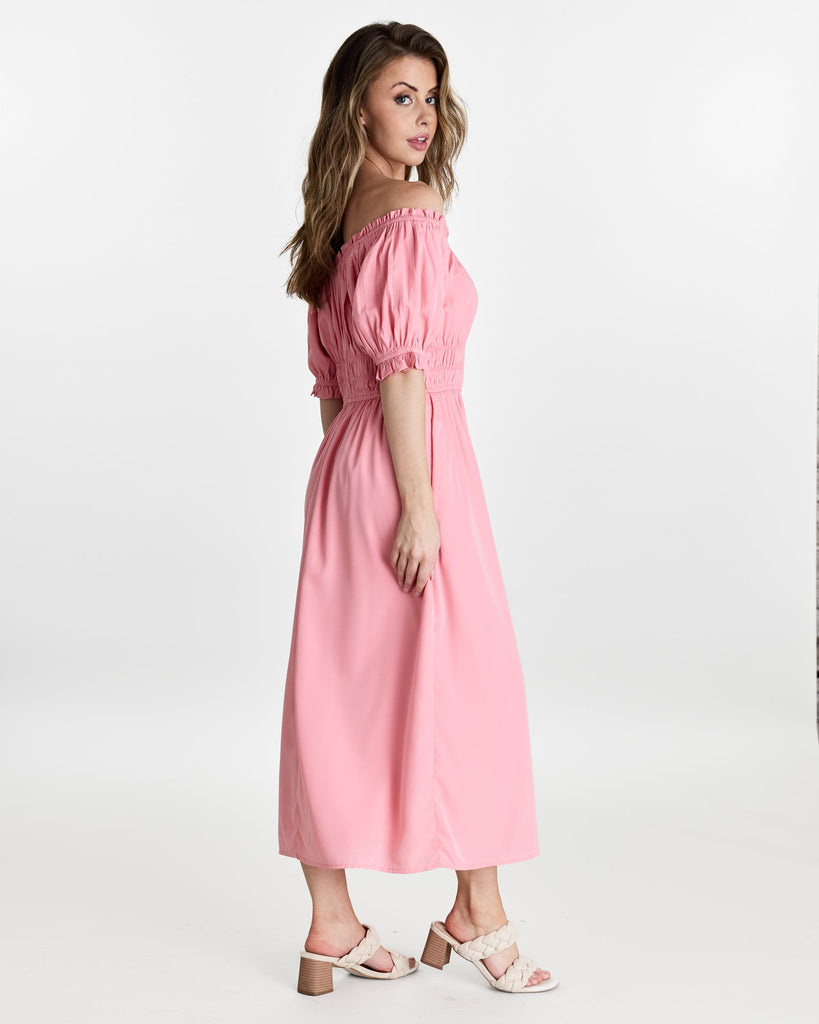 Woman in a short sleeve, off the shoulder, midi-length dress