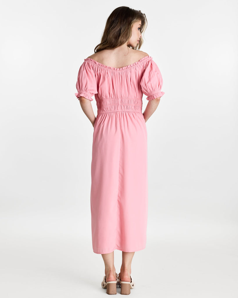 Woman in a short sleeve, off the shoulder, midi-length dress