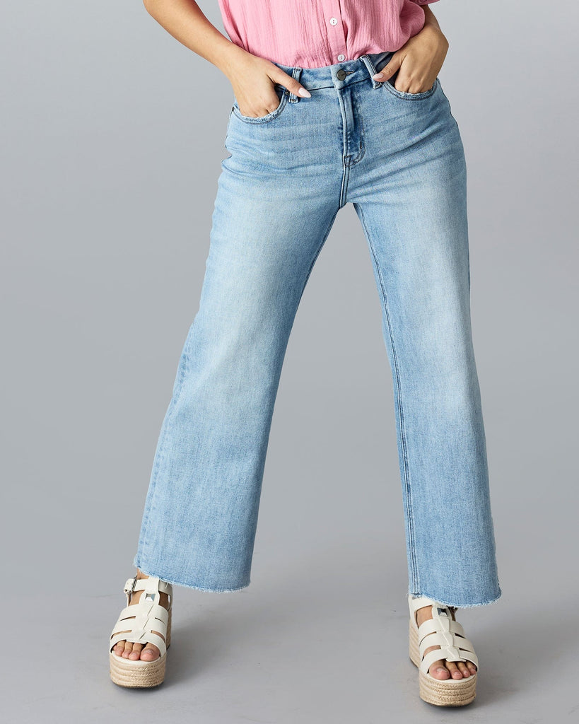 Woman in blue wide leg denim pants.