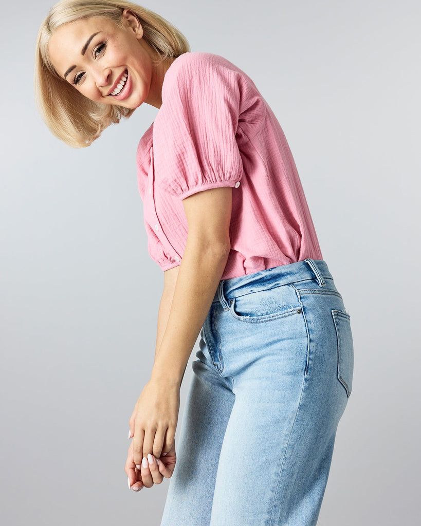 Woman in blue wide leg denim pants.