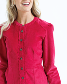 Red dress with black buttons worn by a woman on a white background