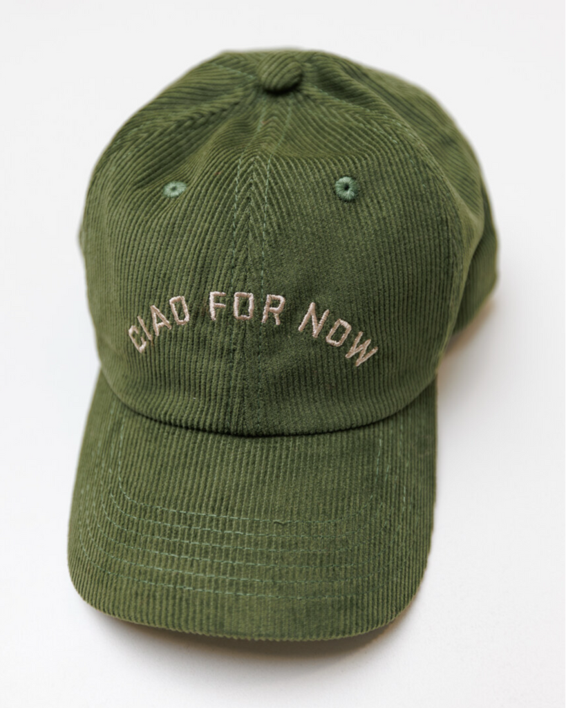 Green baseball cap with 'Ciao for Now' embroidered text on a white background