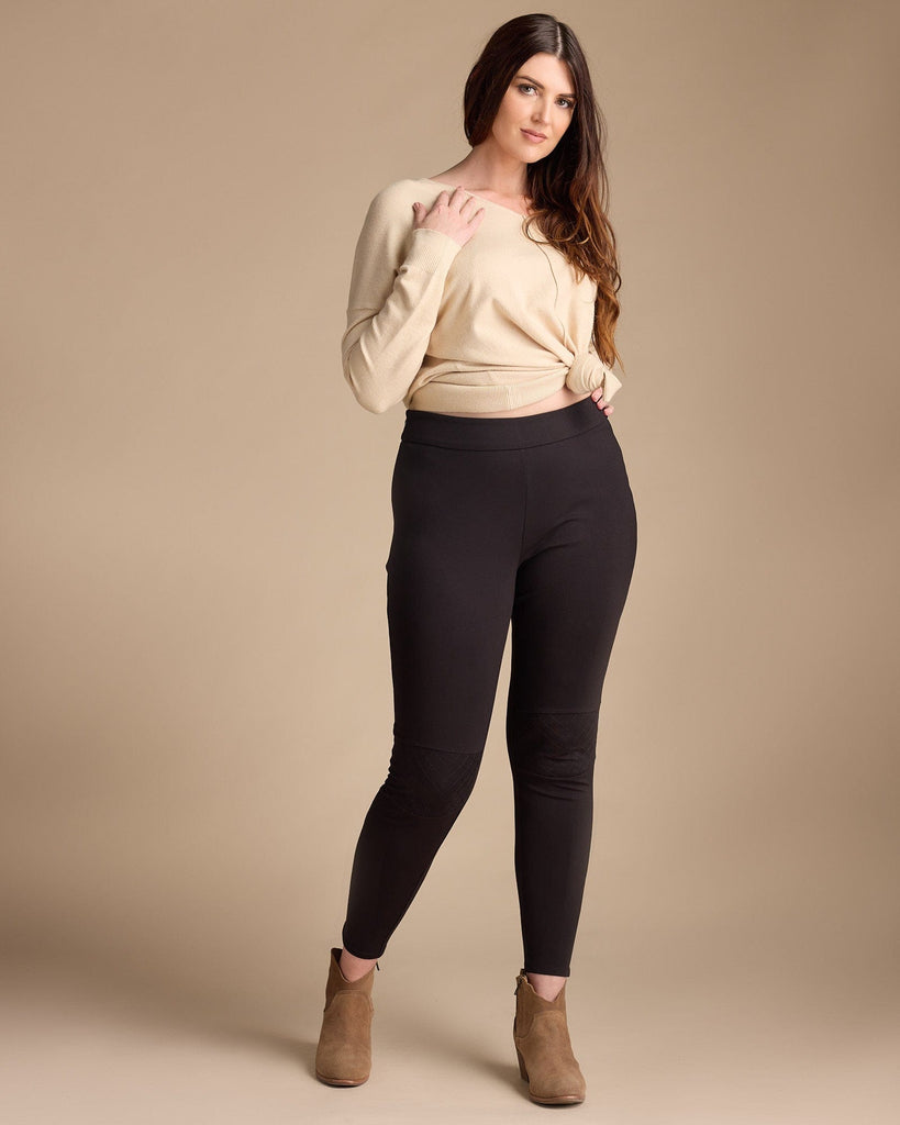 Woman in black, high-waisted leggings