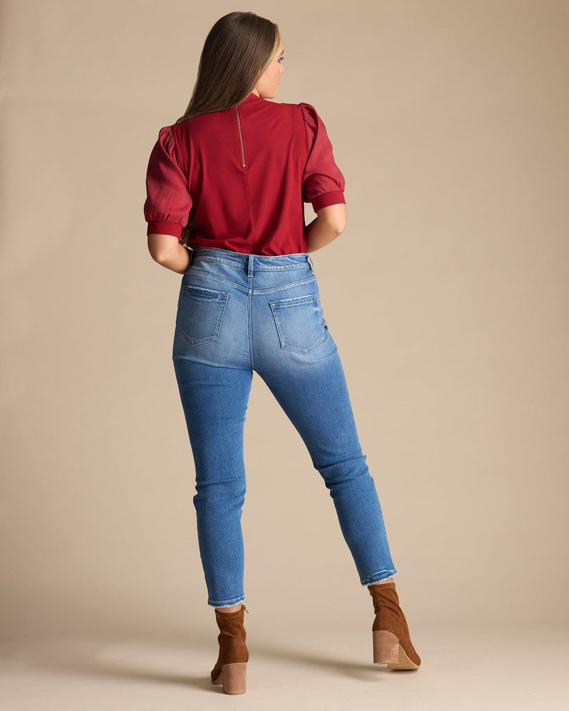 Woman in blue high-rise skinny jeans