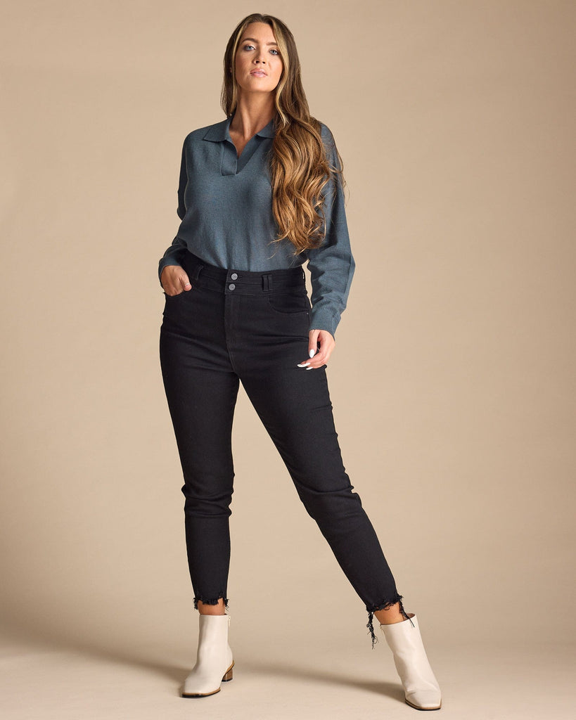 Woman in black high-rise skinny cropped jeans