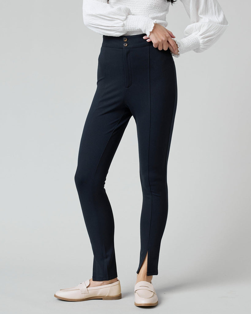 Woman in black fitted pants