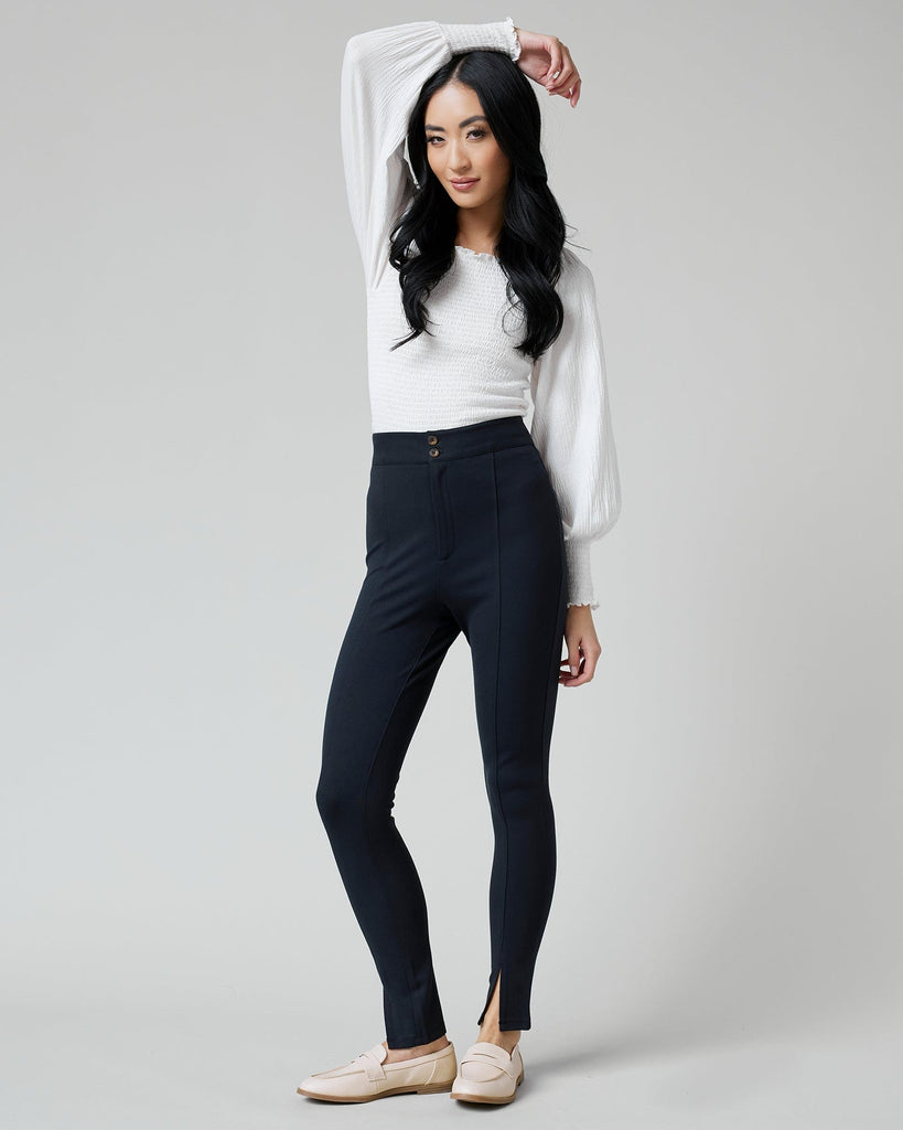 Woman in black fitted pants