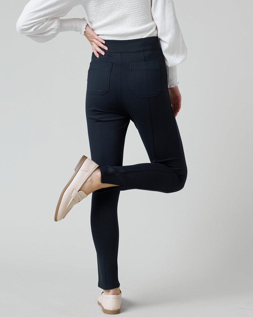 Woman in black fitted pants