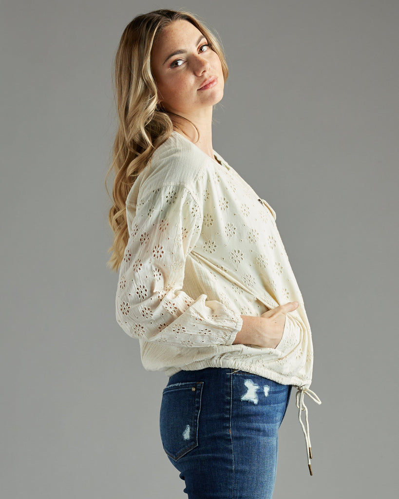 Woman in a white bomber jacket