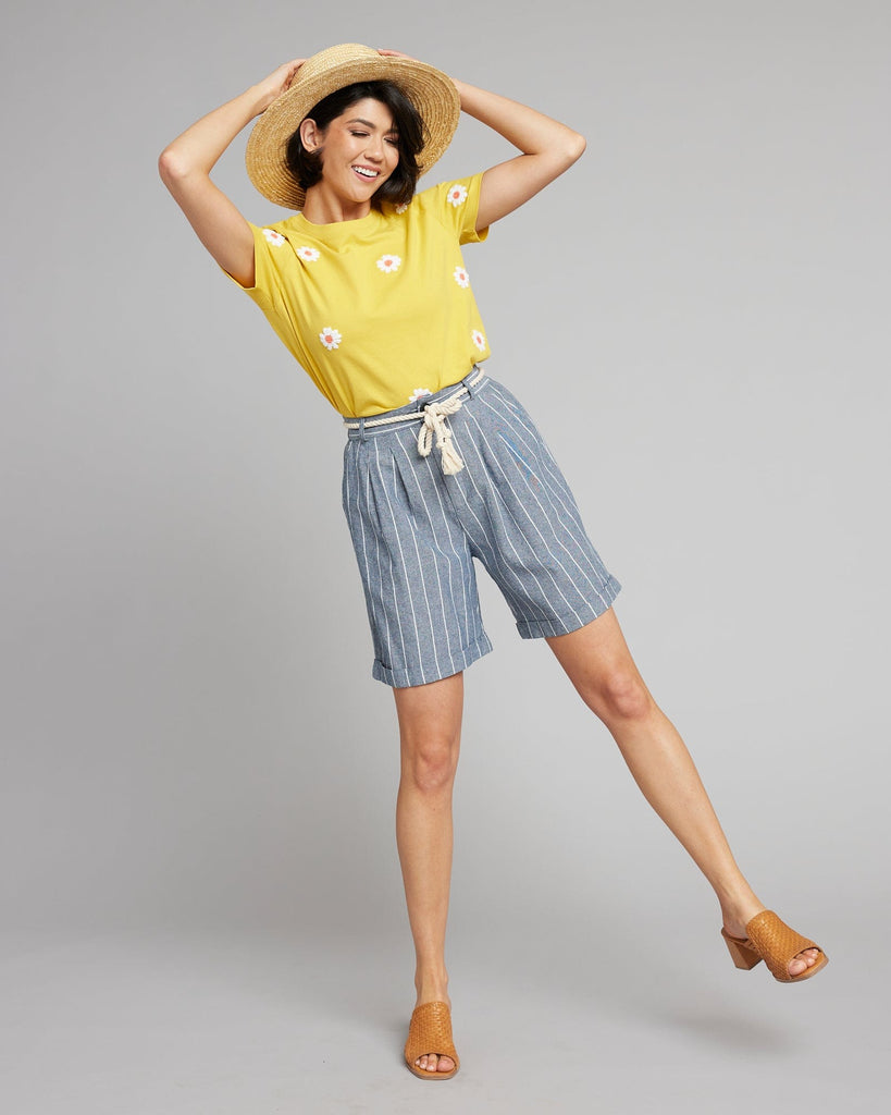 Woman in blue and white vertical striped shorts