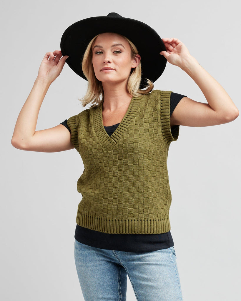 Woman in a textured knit pullover vest