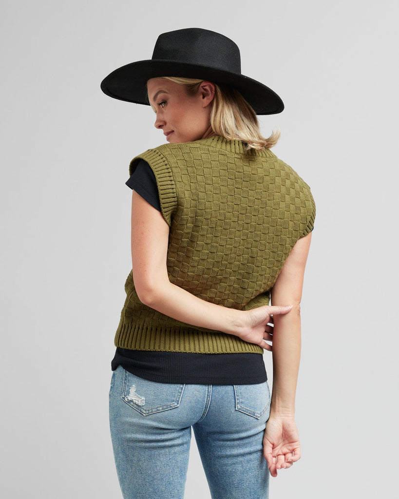 Woman in a textured knit pullover vest