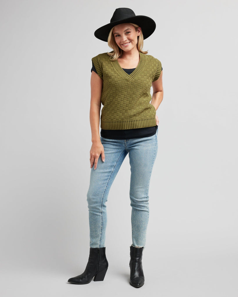 Woman in a textured knit pullover vest