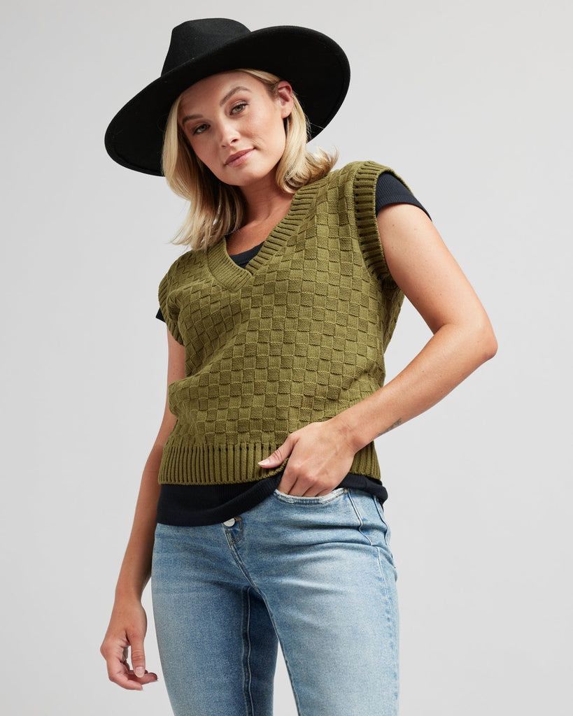 Woman in a textured knit pullover vest