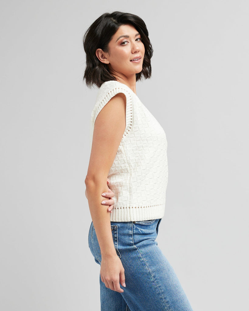 Woman in a textured knit pullover vest