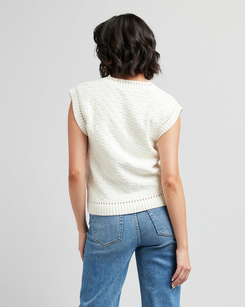 Woman in a textured knit pullover vest