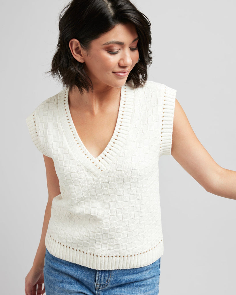 Woman in a textured knit pullover vest